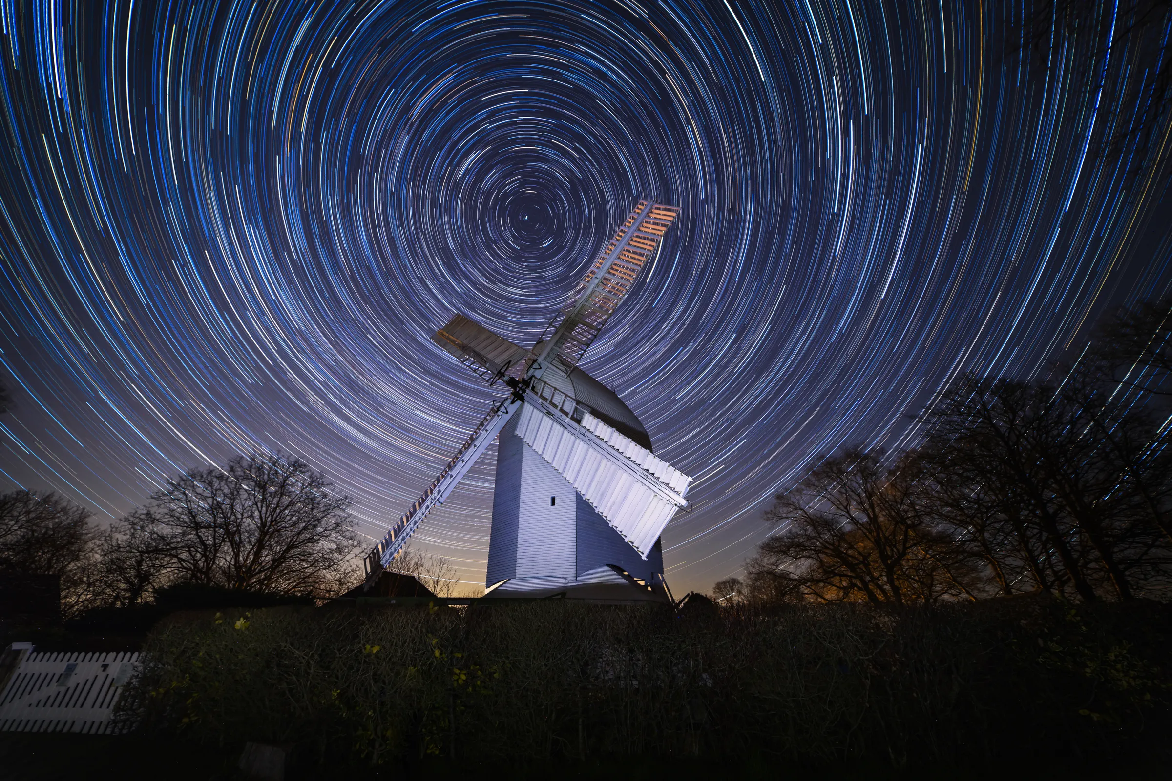 Star trails circling above Oldlands Windmill in Hassocks under a clear winter night sky